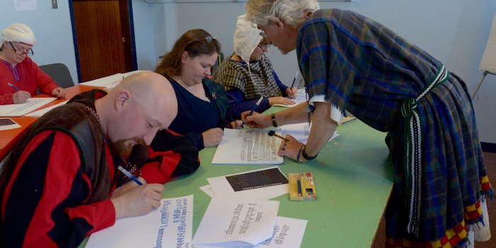 Students learning calligraphy.